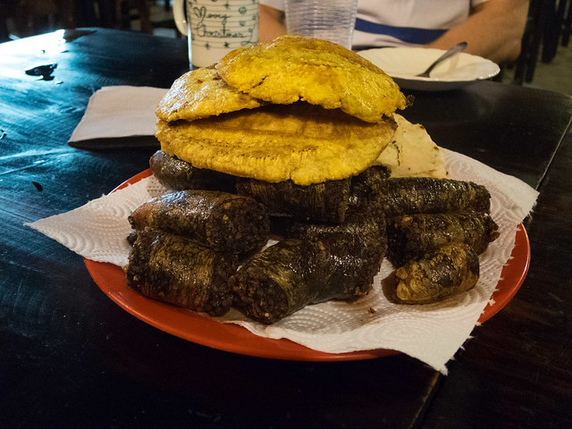 Morcilla (blood sausage) and patacones (fried plantains)