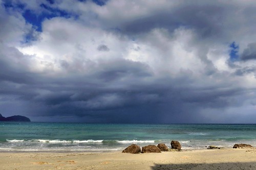 sunlight beach clouds spain rocks europe waves shore mallorca mediterraneansea ca´npicafort