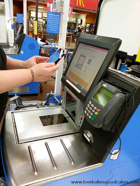 Using scan and go at the self checkout register at walmart.
