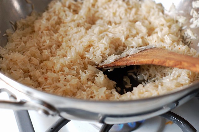 Sauteeing basmati rice in onion and peanut oil by Eve Fox, the Garden of Eating, copyright 2014