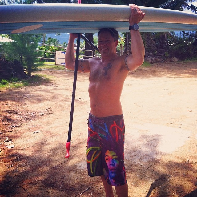 Joshy getting ready to paddle board the Hanalei River.