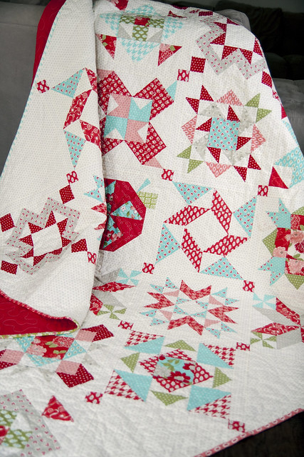 2012 Designer Mystery block of the month quilt by Fat Quarter Shop. PDF patterns available for 12 block patterns + the finishing kit. Fabric is Vintage Modern by Bonnie & Camille or Moda Fabrics.
