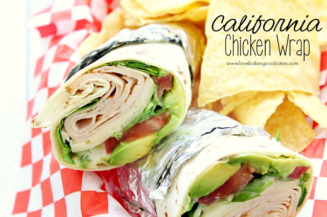 California Chicken Wrap cut in half in basket with chips.