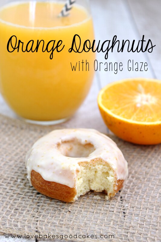 Orange Doughnut with Orange Glaze and a glass of orange juice.