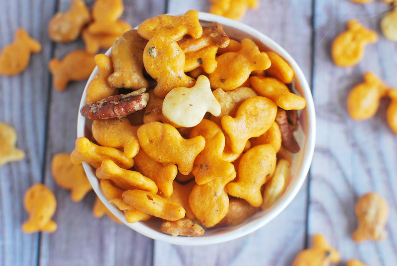 Cheddar, Parmesan, and Pretzel Goldfish tossed with pecans in a buttery, savory ranch mixture and baked until delicious. Perfect for a party snack!