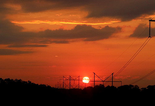 nature sun sunrise orange gold purple clouds rising rises power powerlines southernoklahoma oklahoma sky electric electricity morning