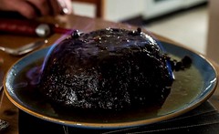 Pum pudding, dried fruit held together by eggs and suet, sometimes moistened by treacle or molasses and flavoured with cinnamon, nutmeg, cloves, ginger, and other spices. pudding is aged for a month, or even a year, alcohol precents it from spoil...