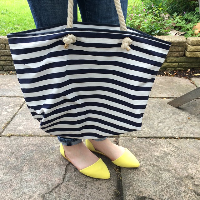 Yellow two part flats and striped beach bag from Next.