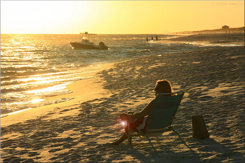 florida sunset beach waterside light sea ocean people boat