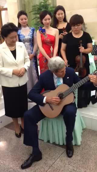 Secretary Kerry Plays Musician's Guitar for Chinese Vice Premier Liu in Beijing