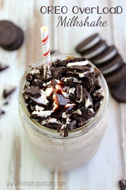 Oreo Overload Milkshake in a glass jar with a straw and OREO cookies.