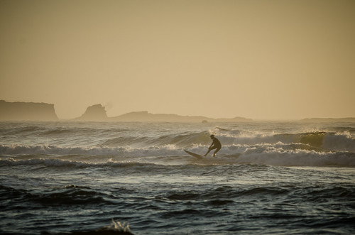 Cape Arago and Surfer from Bastendorf Beach