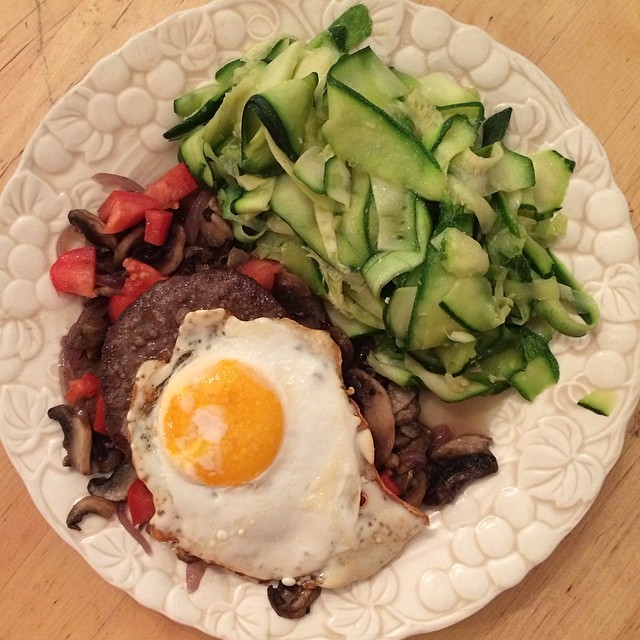 Day 10, #Whole30 - dinner (broiled beef patty & sunny side up egg over sautéed garlic, onion, & mushroom, with fresh chopped tomato, and a side of zucchini ribbons)