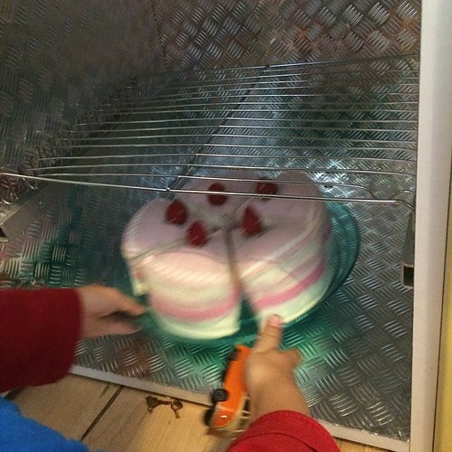 LB is #baking a #cake in his play kitchen #oven that I made him last year. Blog post with all the construction details coming soon.