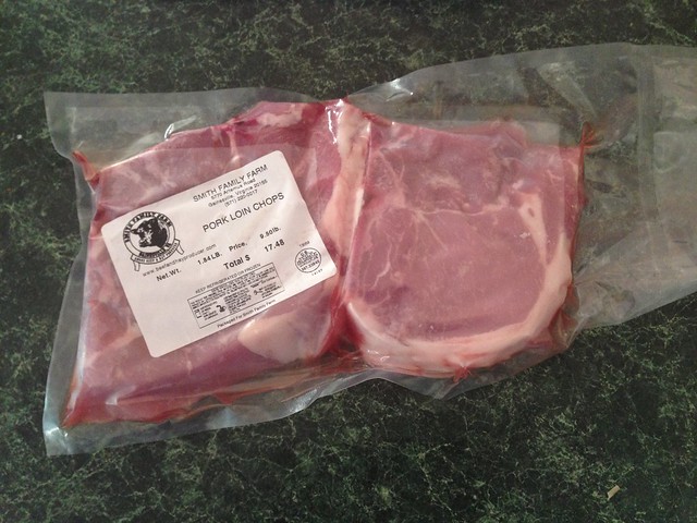 Two raw pork chops from Smith Family Farm