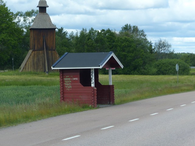 Bus stop and wooden bell tower