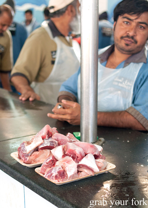 Cleaned and diced fish ready for pickup at Dubai Fish Market in Deira