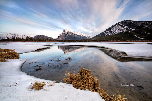 banffnationalpark vermillionlakes rundlemountain snow snowcapped ice water lakes clouds reflections mirror grass april momentsbyceline landscape landscapes scenery scenic sky mountains nature outdoors alberta canada