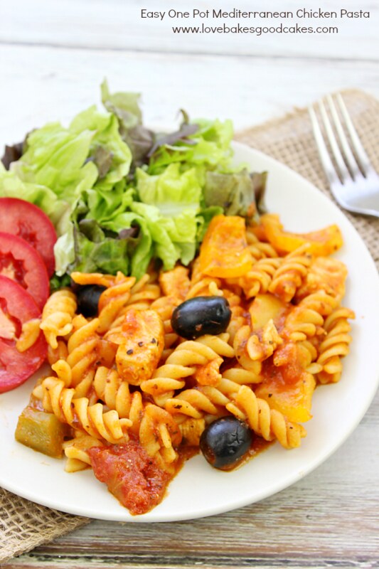 Easy One Pot Mediterranean Chicken Pasta in a white bowl with a fork.