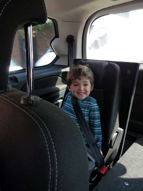 Eskil VERY excited to have his own seat in a taxi