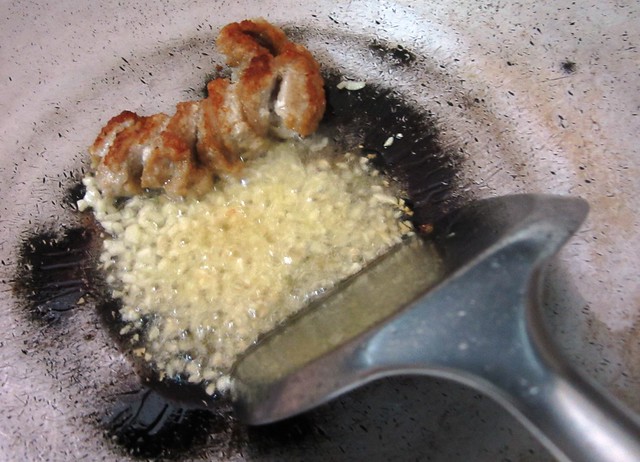 Frying the sausage & garlic