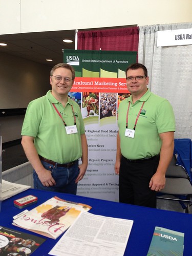 USDA Dairy Program’s Roger Cryan, Director of the Economics Division (left), and Butch Speth, National Supervisor of Dairy Market News, answered questions and spoke with stakeholders at the 2014 World Dairy Expo in Madison, Wisconsin.