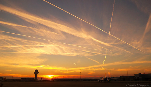 uk greatbritain pink blue sunset sky orange cloud sun color colour tower nature colors sunshine weather silhouette clouds plane airplane sussex colorful skies contrail colours sundown natural westsussex unitedkingdom aircraft jet trails sunny aeroplane theskyabove apron trail gb colourful contrails gatwick controltower lgw gatwickairport londongatwick skyabove skiesabove airside egkk londongatwickairport