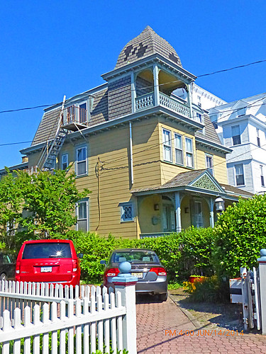 beach yellow architecture seaside newjersey columns victorian cupola fireescape capemay gingerbreadhouse sideview jerseyshore railings picketfence dormers porches capemaycounty victorianhotel mansardroof barrierisland pointedcurvedsquareroof topfloorporchunderpointedroof 19oceanst