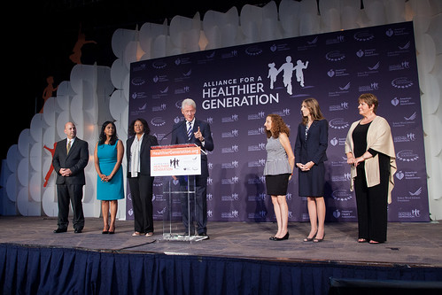 Principal Kimberly Norton of Danville, Ill (second from right) stands on stage with President Clinton at the 2014 Leaders Summit hosted by the Alliance for a Healthier Generation. Photo credit: Scott Henrichsen