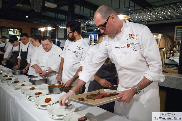 Chef Mark Ladner (front of the line), Chef Luciano Monosillo (center left with the beard) and a bridgade plating their steak dish