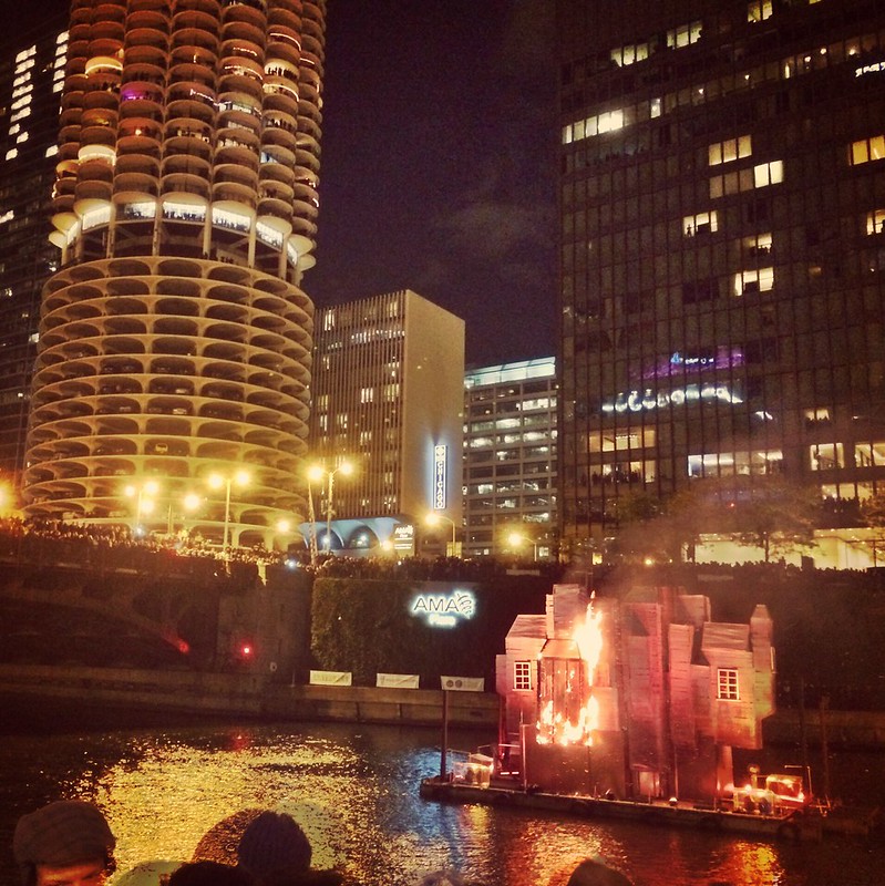 The third house finally starts to burn on the Chicago River at the Great Chicago Fire Festival