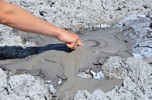 woman moon cold landscape volcano hand mud finger exploring gas adventure clay crater aragon sicily vulcan geology unreal eruption vulcano saltwater methane vulcanism macalube