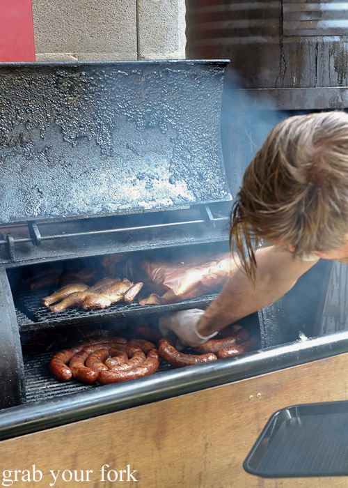 Sausages and chickens in the smoker at Bluebonnet BBQ, Collingwood