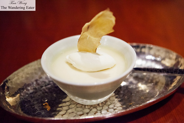 Vanilla panna cotta topped with dried ginger chip